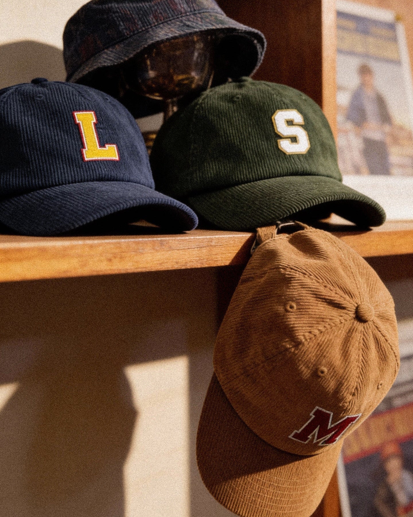 Baron & Buck varsity monogram corduroy caps displayed together, inspired by collegiate sport tradition and designed for shared family wear.