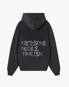 Back view of Baron & Buck ash hoodie featuring white text that reads, “Nietzsche. Nudes. Nihilism.” — a soft, poetic streetwear statement.