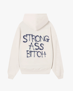 Back view of Baron & Buck marshmallow hoodie featuring blue text that reads, “Strong ass bitch” — a soft, poetic streetwear statement.