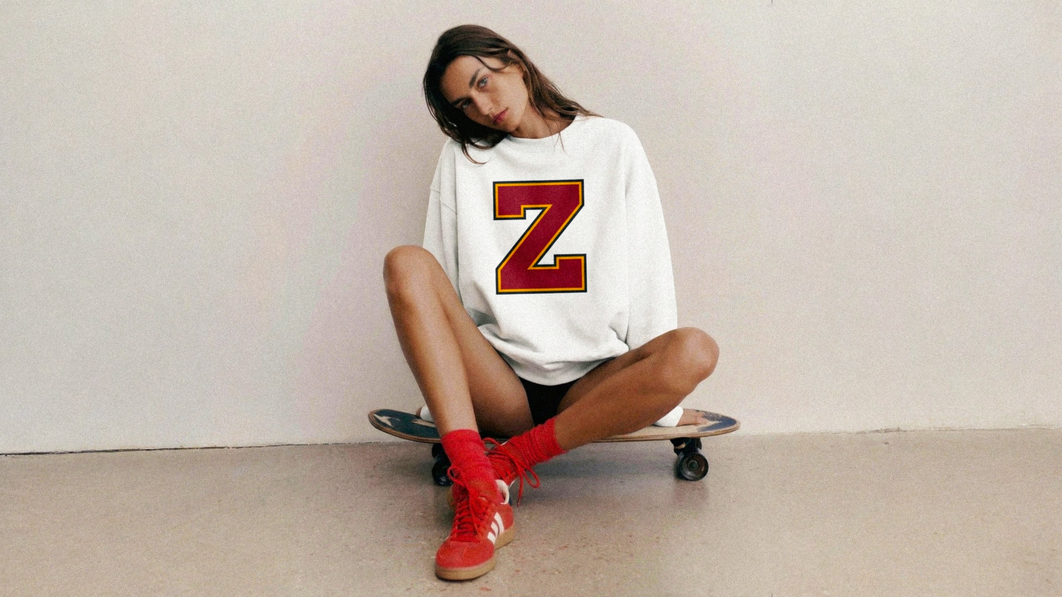 Woman wearing Baron & Buck varsity monogram Z sweatshirt, relaxed fit premium cotton streetwear