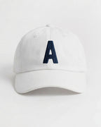 Harbour Monogram White cotton cap with embroidered letter A by Baron & Buck