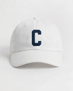 Harbour Monogram White cotton cap with embroidered letter C by Baron & Buck