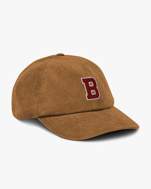 Side angle of Baron and Buck varsity monogram corduroy hat in Camel, showing embroidered monogram and structured crown
