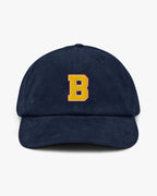 Baron and Buck varsity monogram corduroy hat in Oxford Navy, front view, featuring embroidered initial and classic baseball cap silhouette