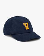 Side angle of Baron and Buck varsity monogram corduroy hat in Oxford Navy, showing embroidered monogram and structured crown