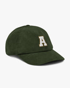 Side angle of Baron and Buck varsity monogram corduroy hat in Dark Olive, showing embroidered monogram and structured crown